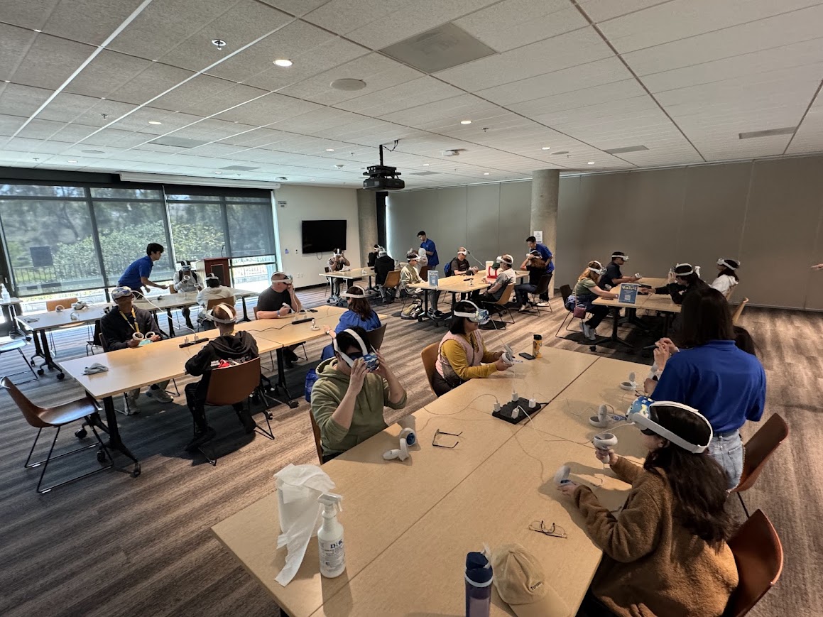 group of students in a conference room wearing VR headsets