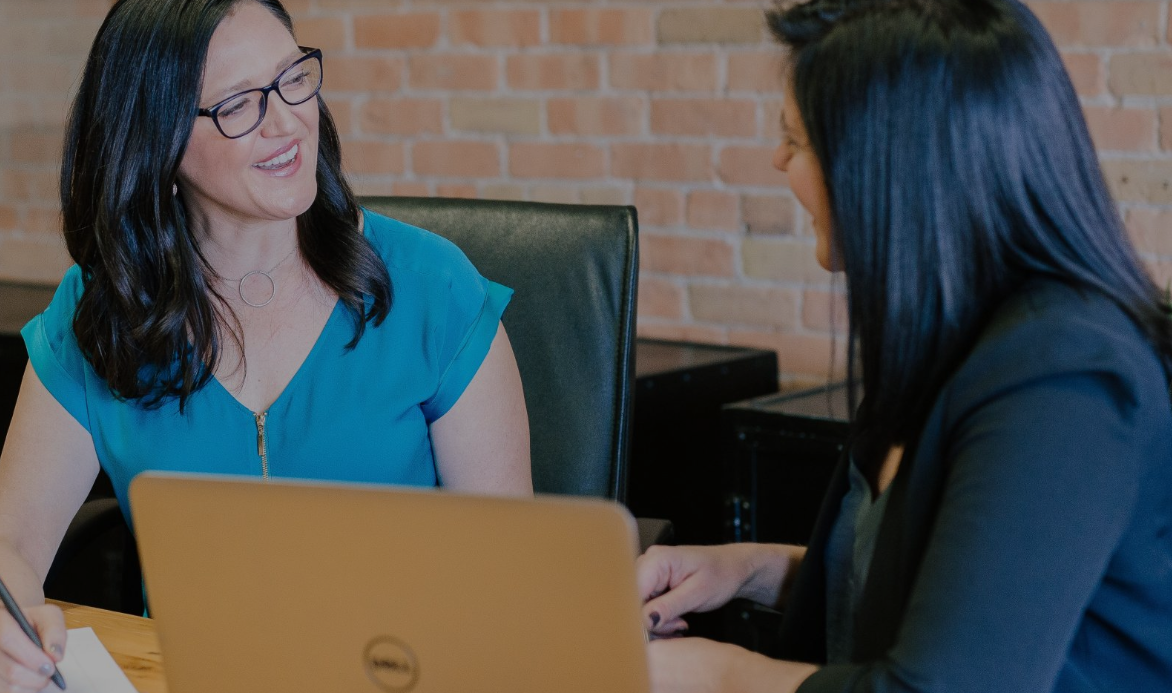 two women collaborating
